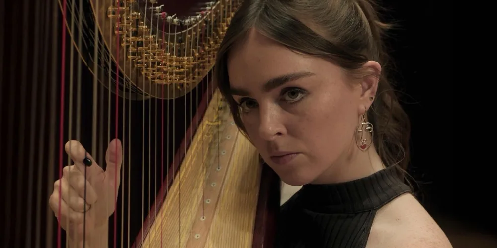 Louisa Connolly-Burnham as harpist Yvonne Mears in An Imperfect Cadence