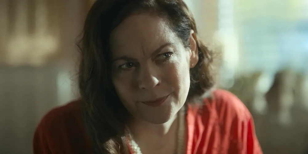 Maria smiles knowingly across the kitchen